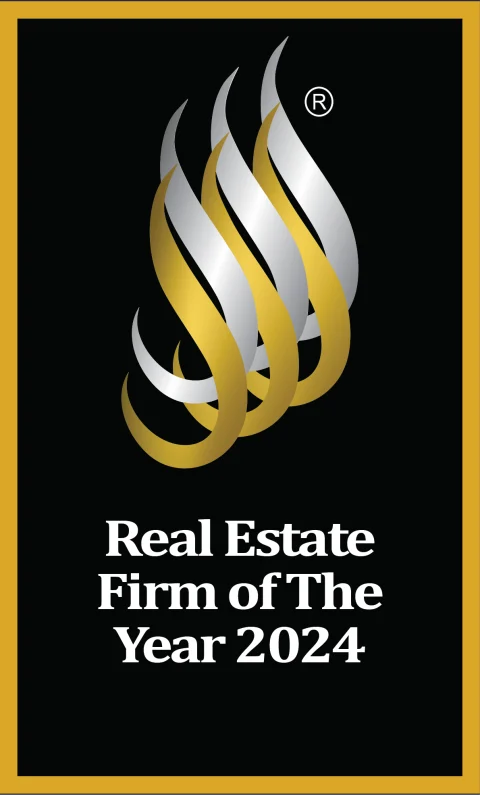 NREA Real Estate Firm of The Year 2024 badge, gold flame on black